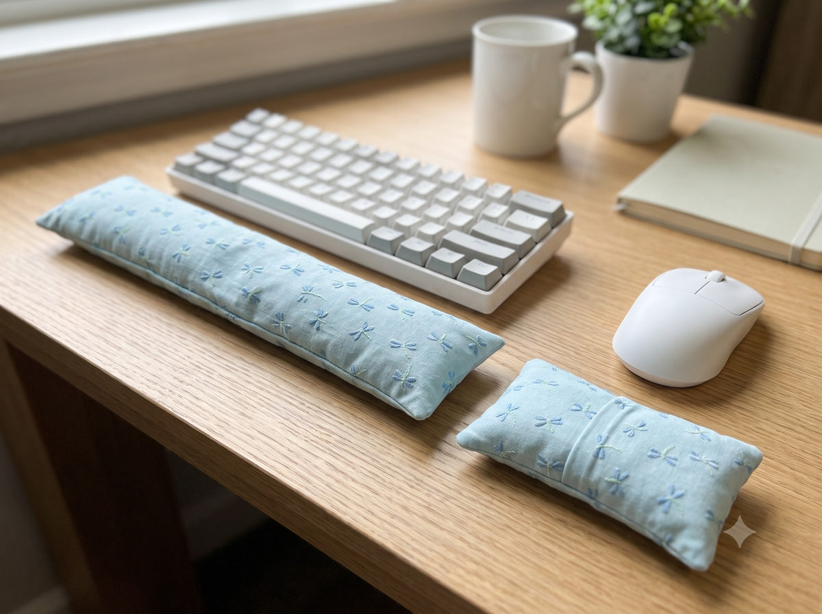 Embroidered dragonfly wrist rest set in front of a keyboard and mouse