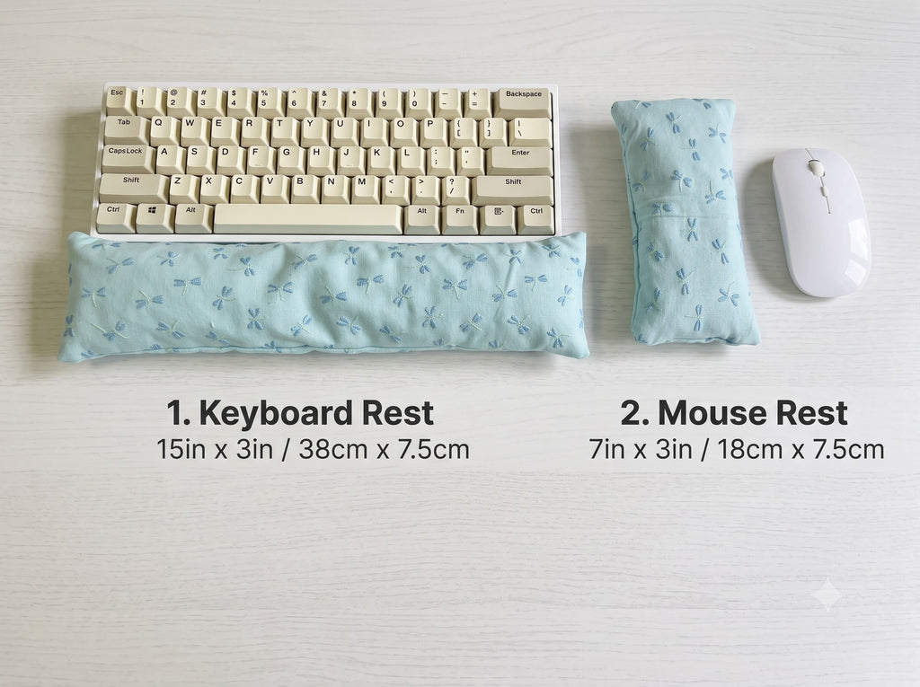 Embroidered dragonfly keyboard rest, 15 × 3 in, and mouse rest, 7 × 3 in, beside a keyboard and mouse