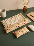 Fall maple leaf keyboard and mouse wrist rests around a keyboard on a dark green desk