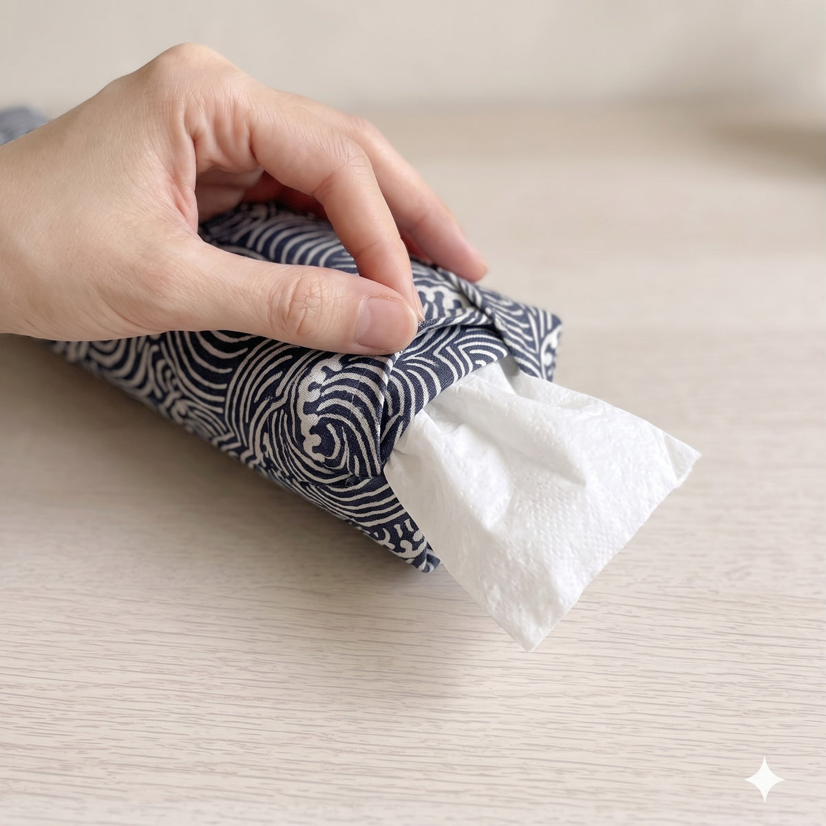 Hand sliding the white inner bag of buckwheat hulls out of the wave print cover