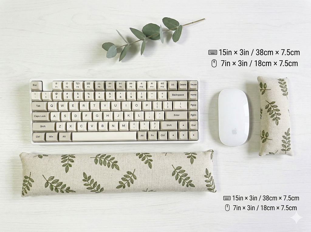 Leaf print keyboard rest, 15 × 3 in, and mouse rest, 7 × 3 in, beside a keyboard and mouse