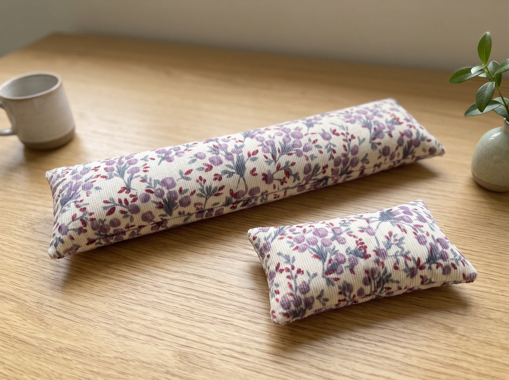 The two pieces of the lilac floral corduroy set, a keyboard wrist rest and a mouse wrist rest