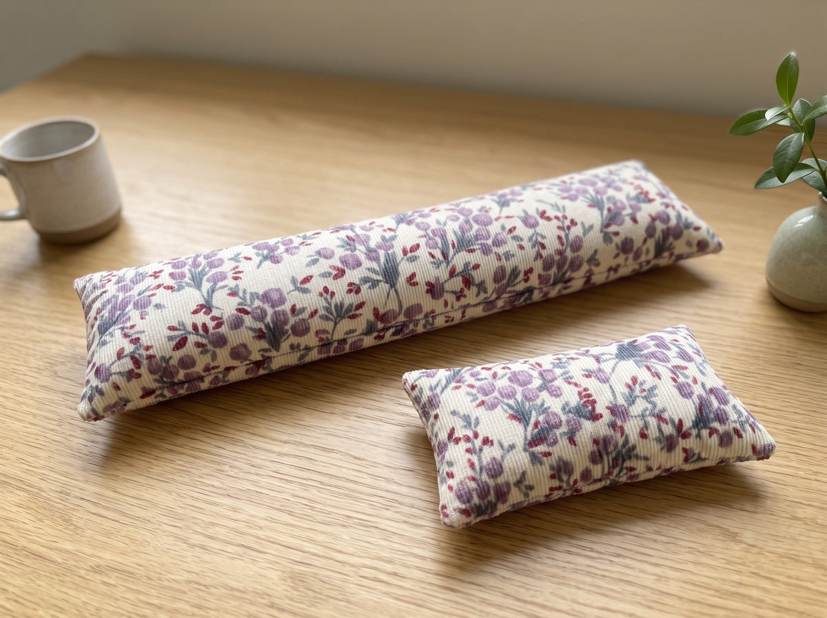 The two pieces of the lilac floral corduroy set, a keyboard wrist rest and a mouse wrist rest