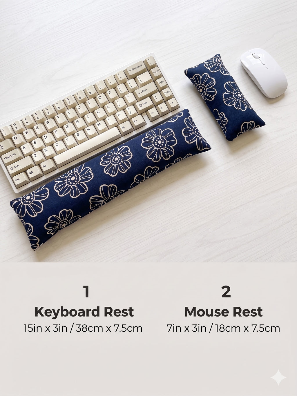 Navy daisy keyboard rest, 15 × 3 in, and mouse rest, 7 × 3 in, beside a keyboard and mouse