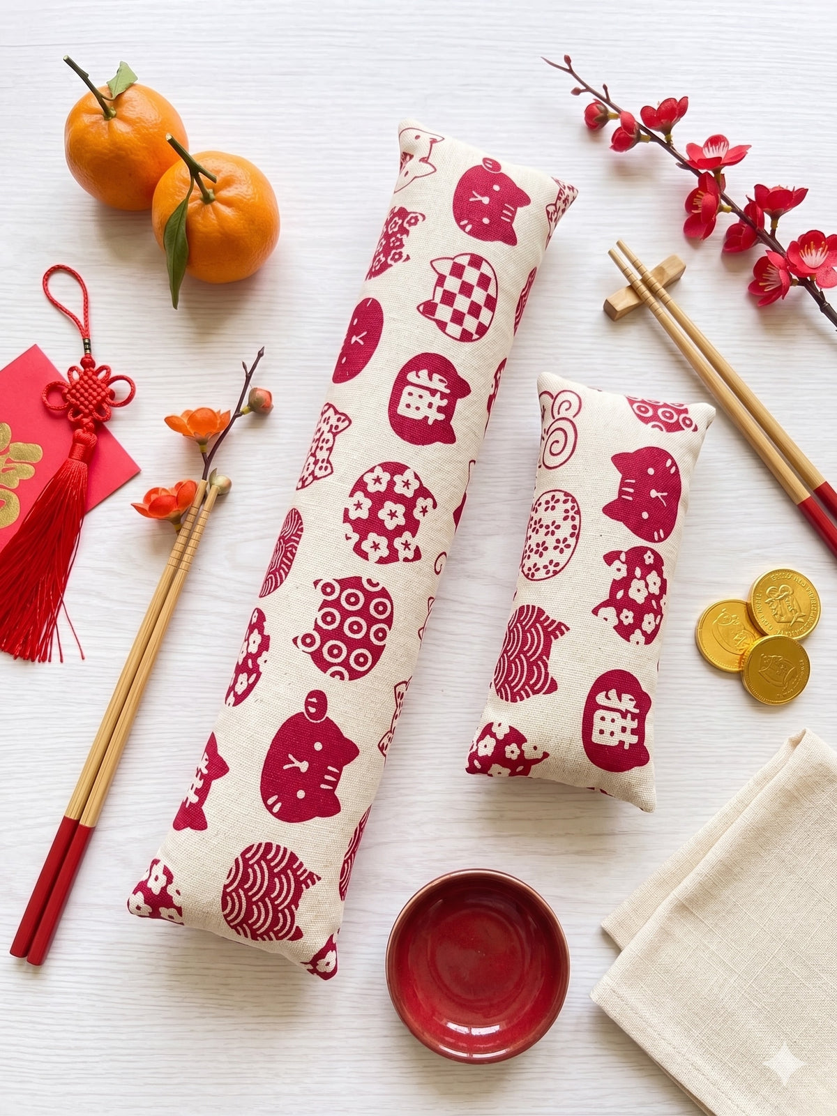 Red Maneki Neko keyboard and mouse wrist rests with red lucky cats on natural linen