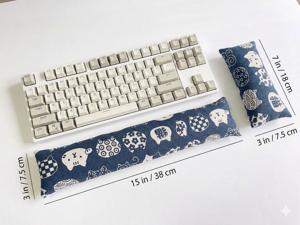 Blue lucky cat keyboard wrist rest measuring 15 inches (38 cm) in front of a keyboard
