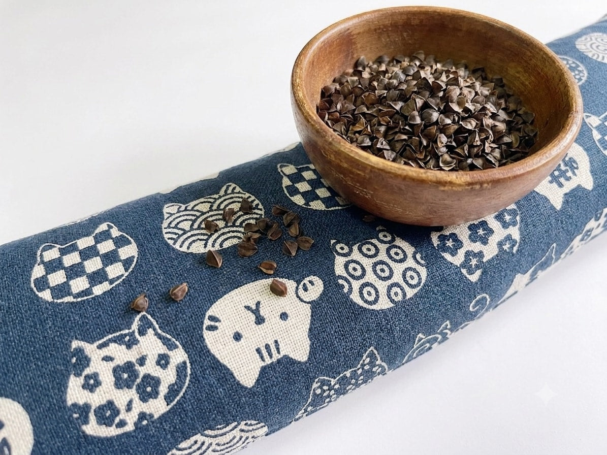 Close-up of the blue cat print beside a bowl of the buckwheat hulls used as filling
