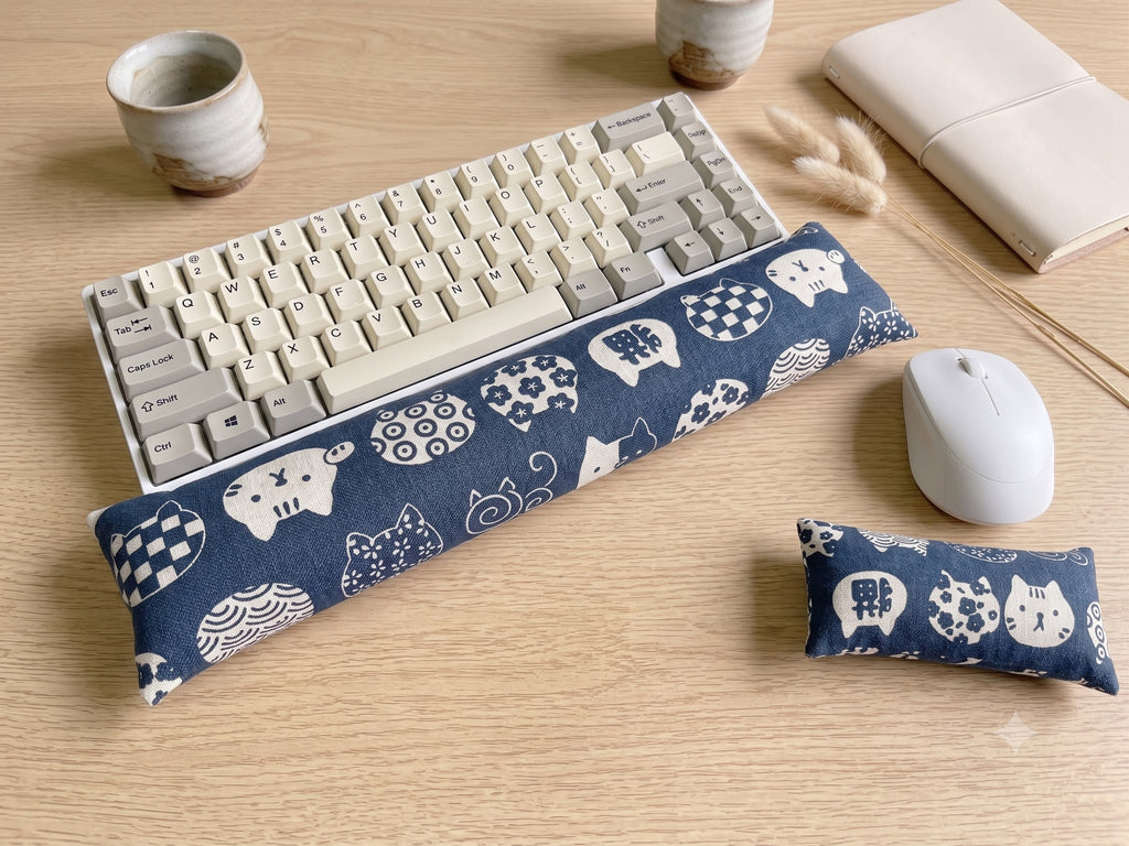 Blue Maneki Neko lucky cat keyboard and mouse wrist rest set on a wooden desk