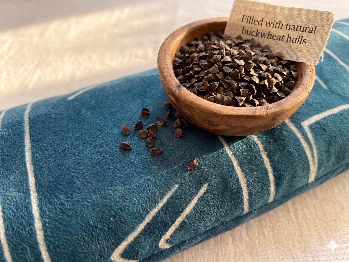 Blue velvet wrist rest with a bowl of buckwheat hulls and a card that reads filled with natural buckwheat hulls