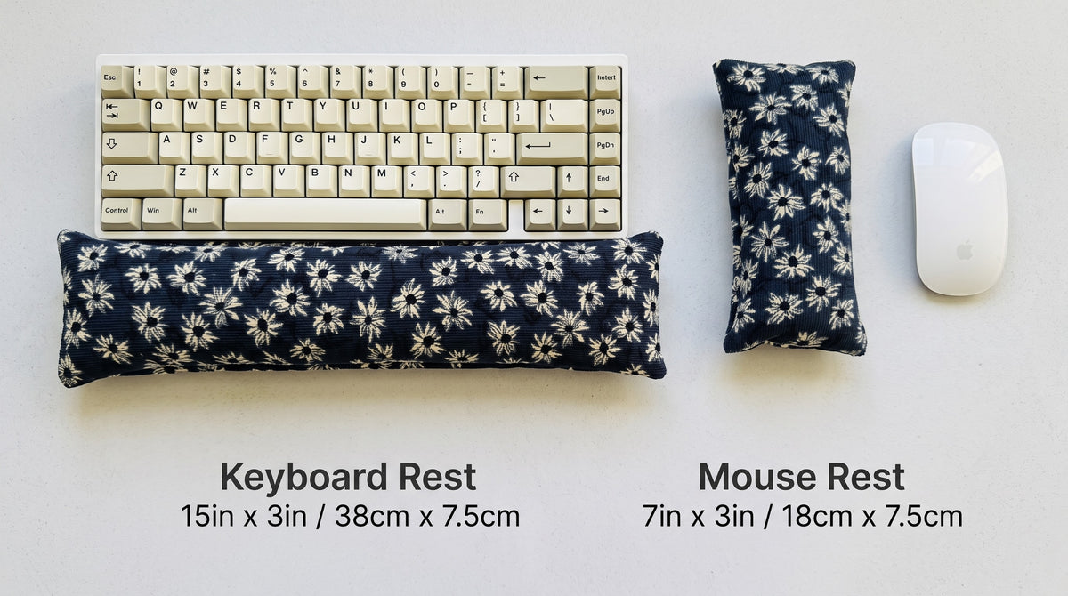 Navy daisy corduroy keyboard rest, 15 × 3 in, and mouse rest, 7 × 3 in, beside a keyboard and mouse