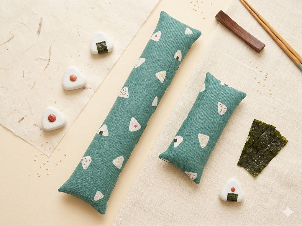 Onigiri print keyboard and mouse wrist rests laid flat with rice ball figurines and nori