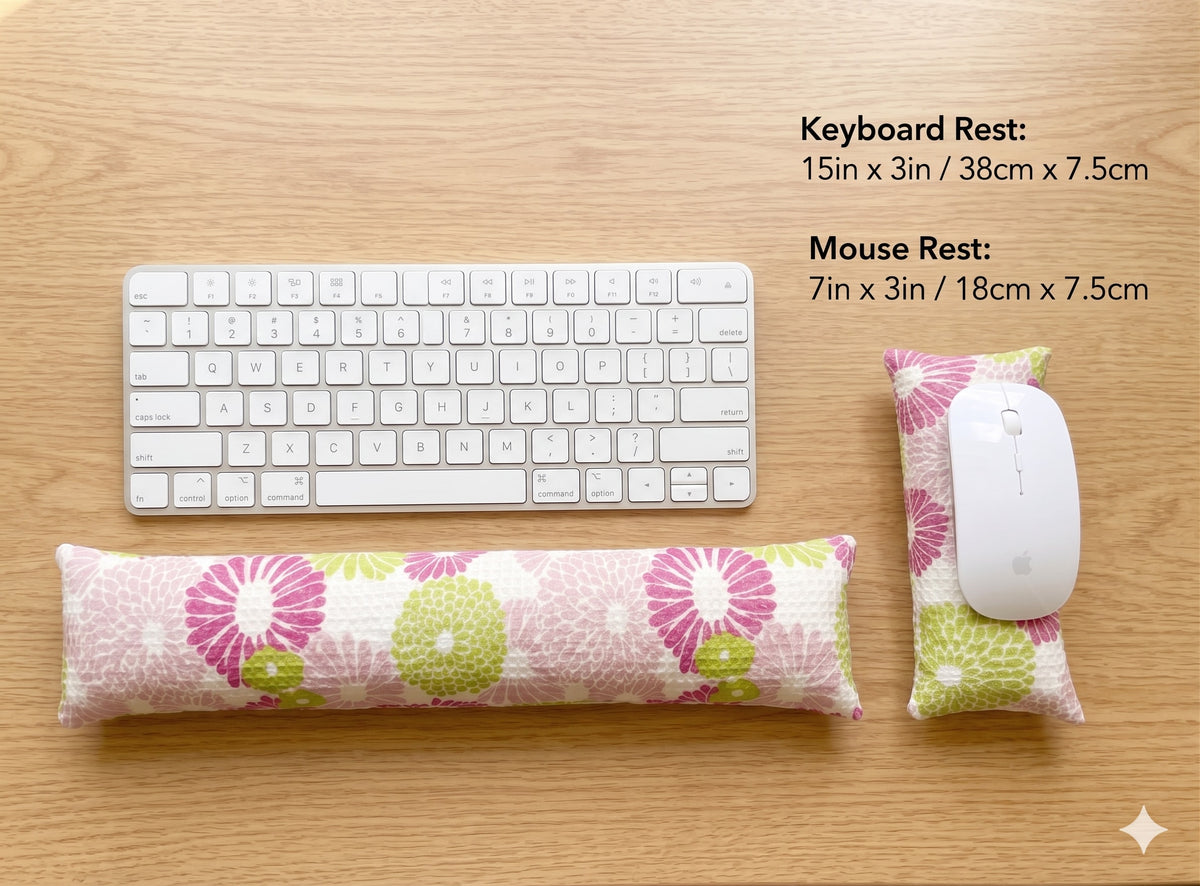 Pink floral keyboard rest, 15 × 3 in, and mouse rest, 7 × 3 in, beside a keyboard and mouse