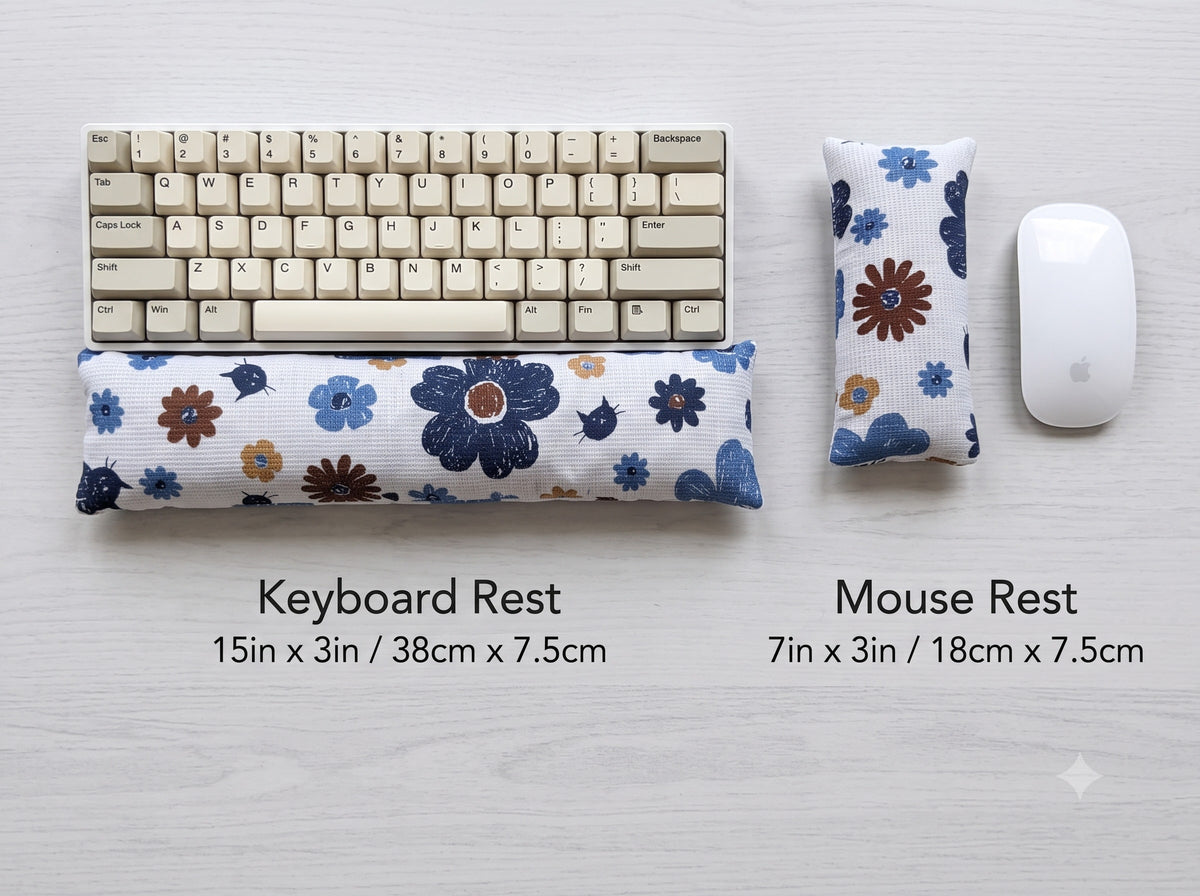 Blue retro floral cat keyboard rest, 15 × 3 in, and mouse rest, 7 × 3 in, beside a keyboard and mouse