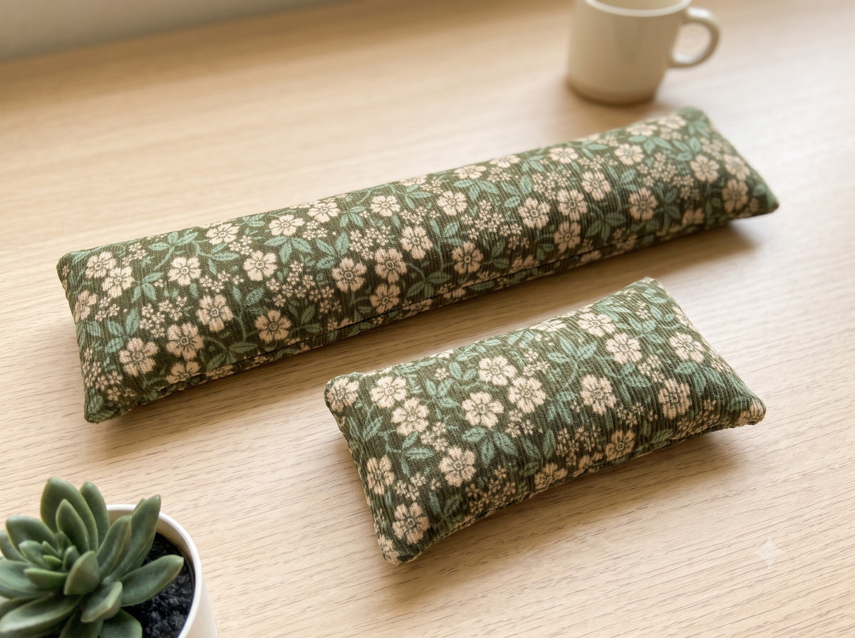 The two pieces of the sage floral corduroy set, a keyboard wrist rest and a mouse wrist rest