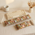 Sage pumpkin floral keyboard and mouse wrist rests around a keyboard with a mug and dried wheat