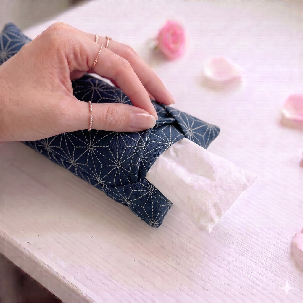 Hand sliding the white inner bag of buckwheat hulls out of the indigo sashiko cover