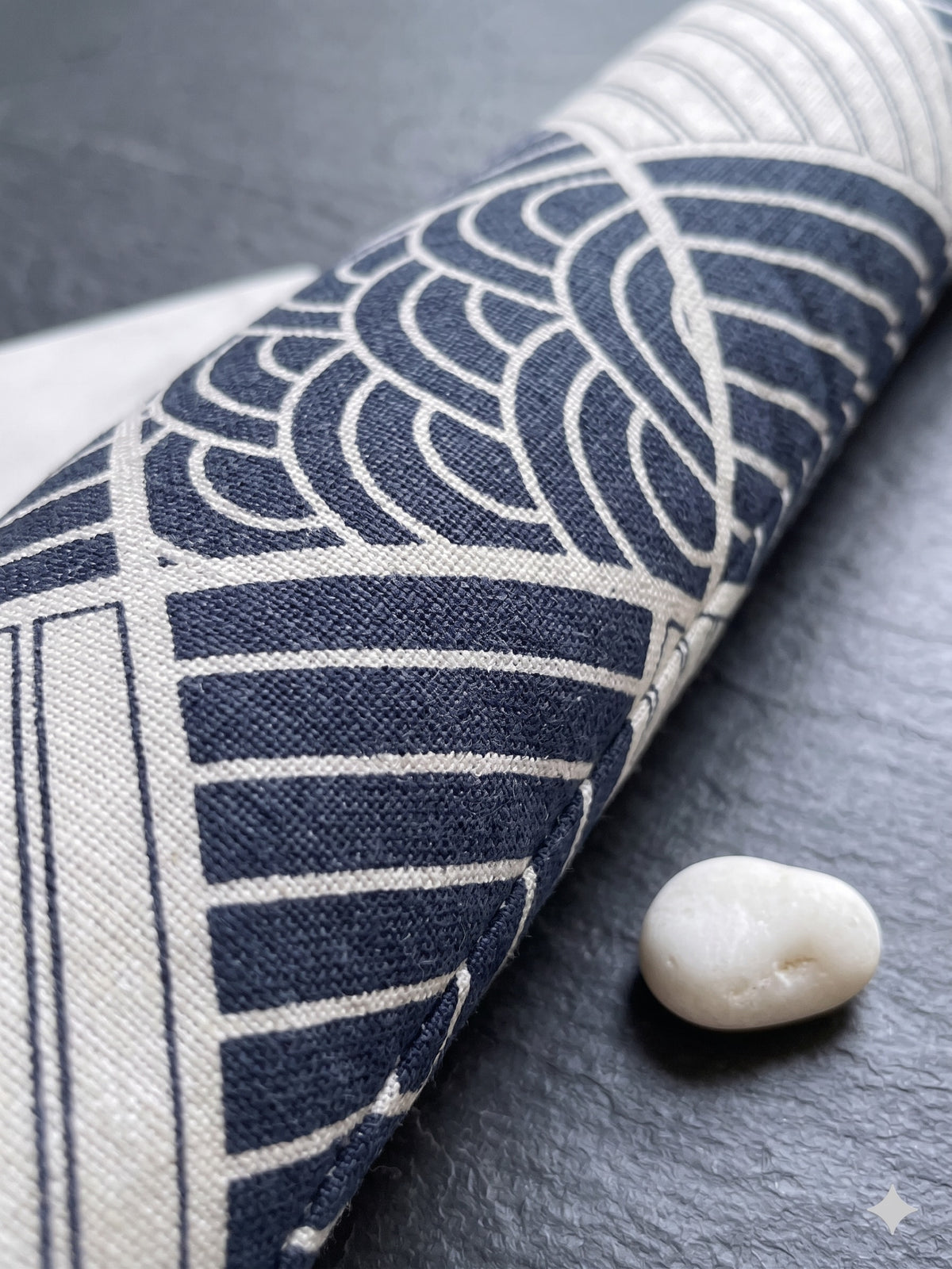 Close-up of indigo wave arcs and cream stripes in the boro patchwork print