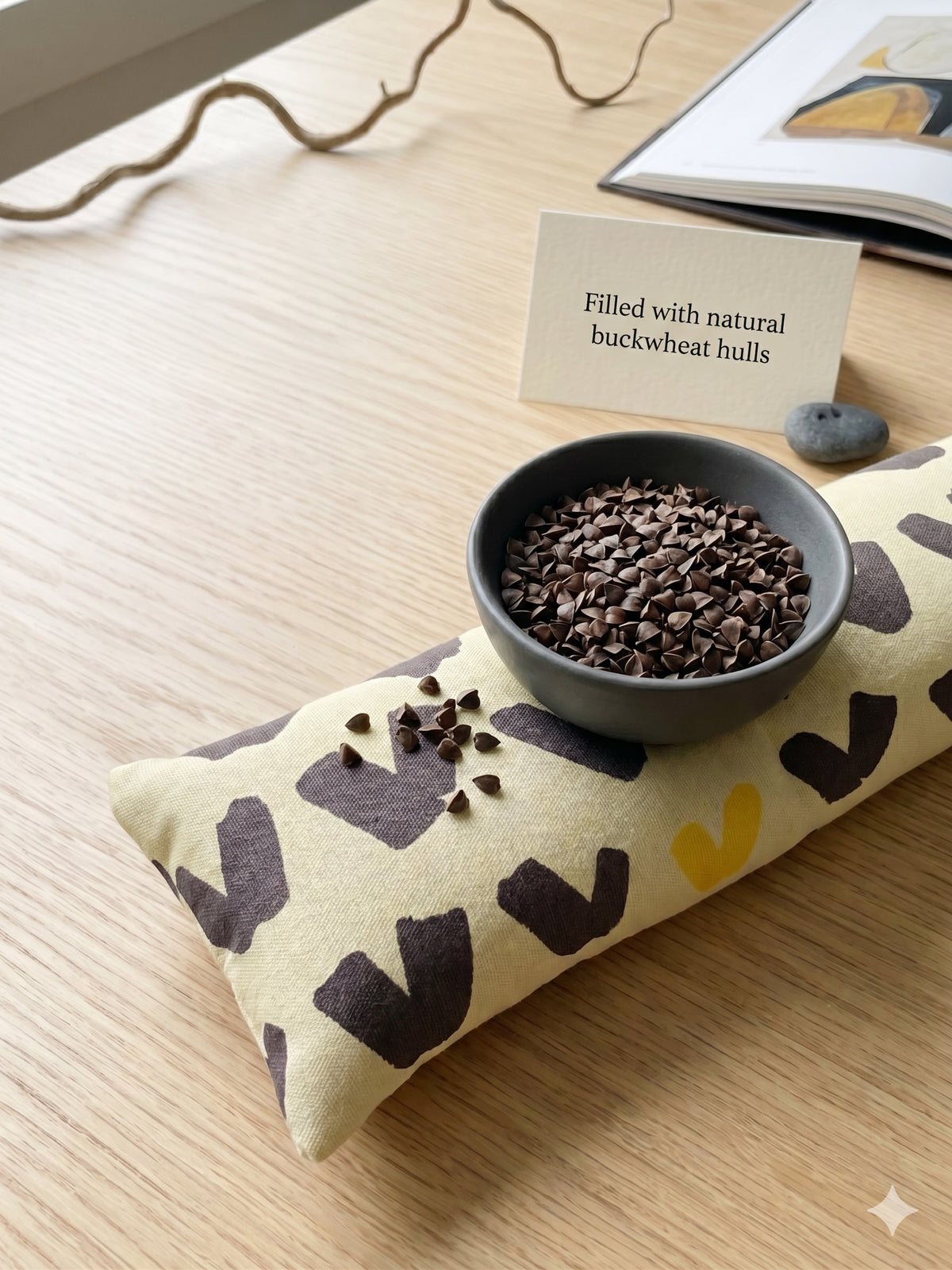 Scandi abstract wrist rest with a bowl of the buckwheat hulls used as filling