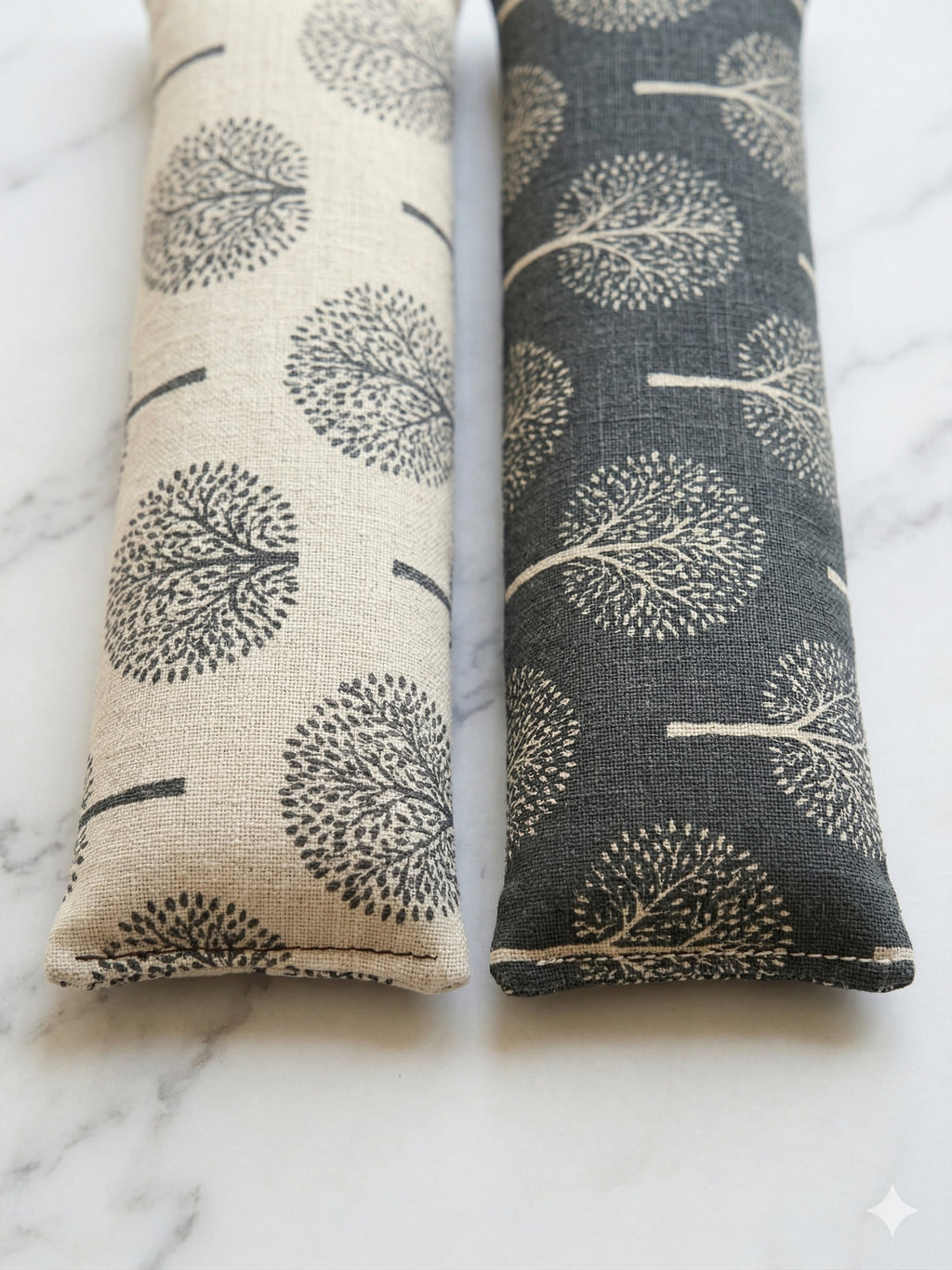 Close-up of the light and dark tree print wrist rests side by side