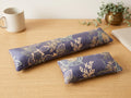 Twilight bloom velvet keyboard and mouse wrist rests on a wooden desk with a potted plant