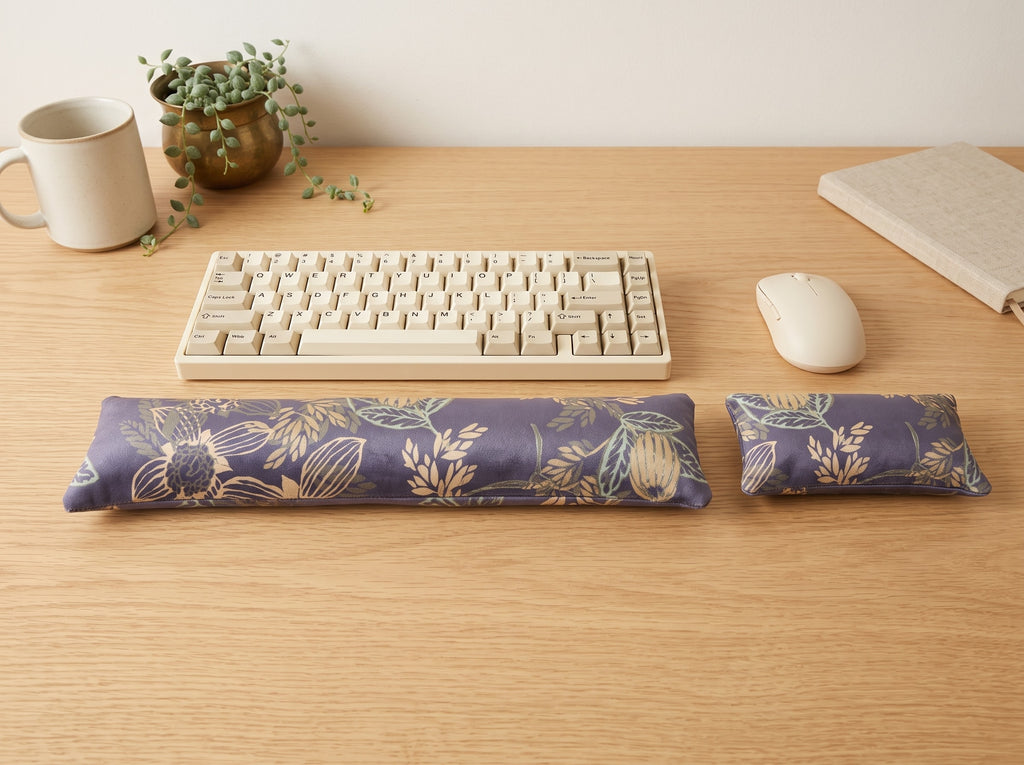 Twilight bloom velvet wrist rest set in front of a keyboard and mouse