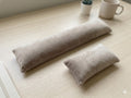 Taupe velvet keyboard wrist rest and mouse wrist rest on a wooden desk