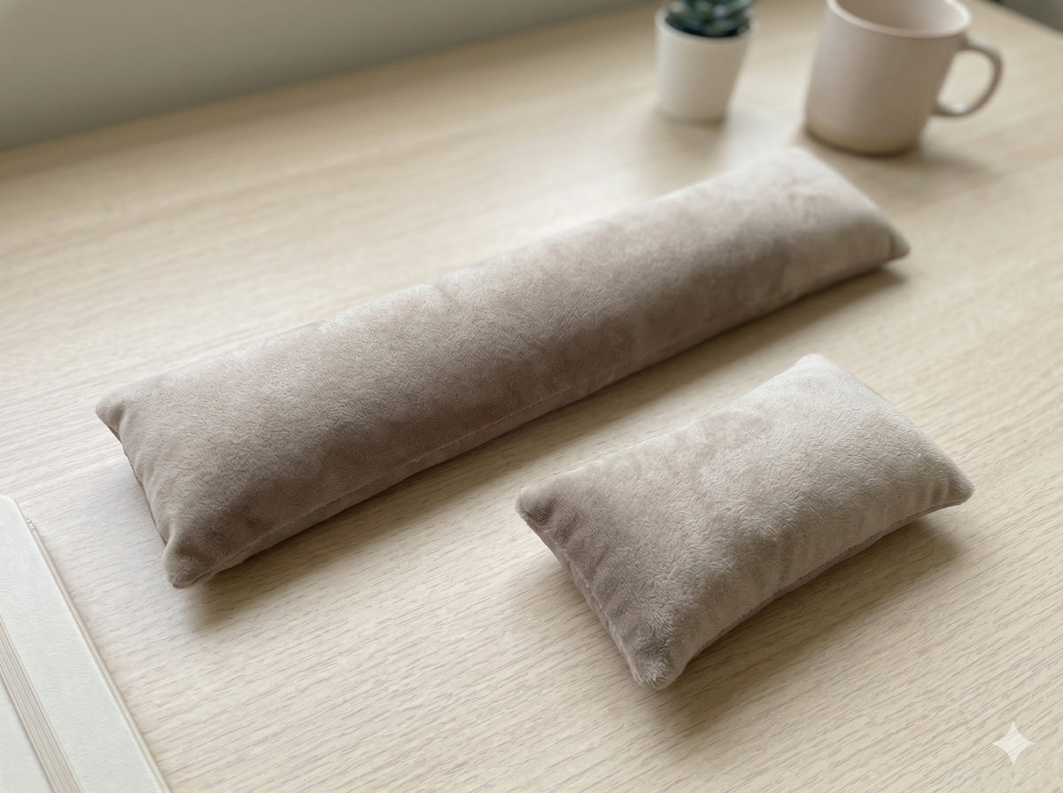 Taupe velvet keyboard wrist rest and mouse wrist rest on a wooden desk