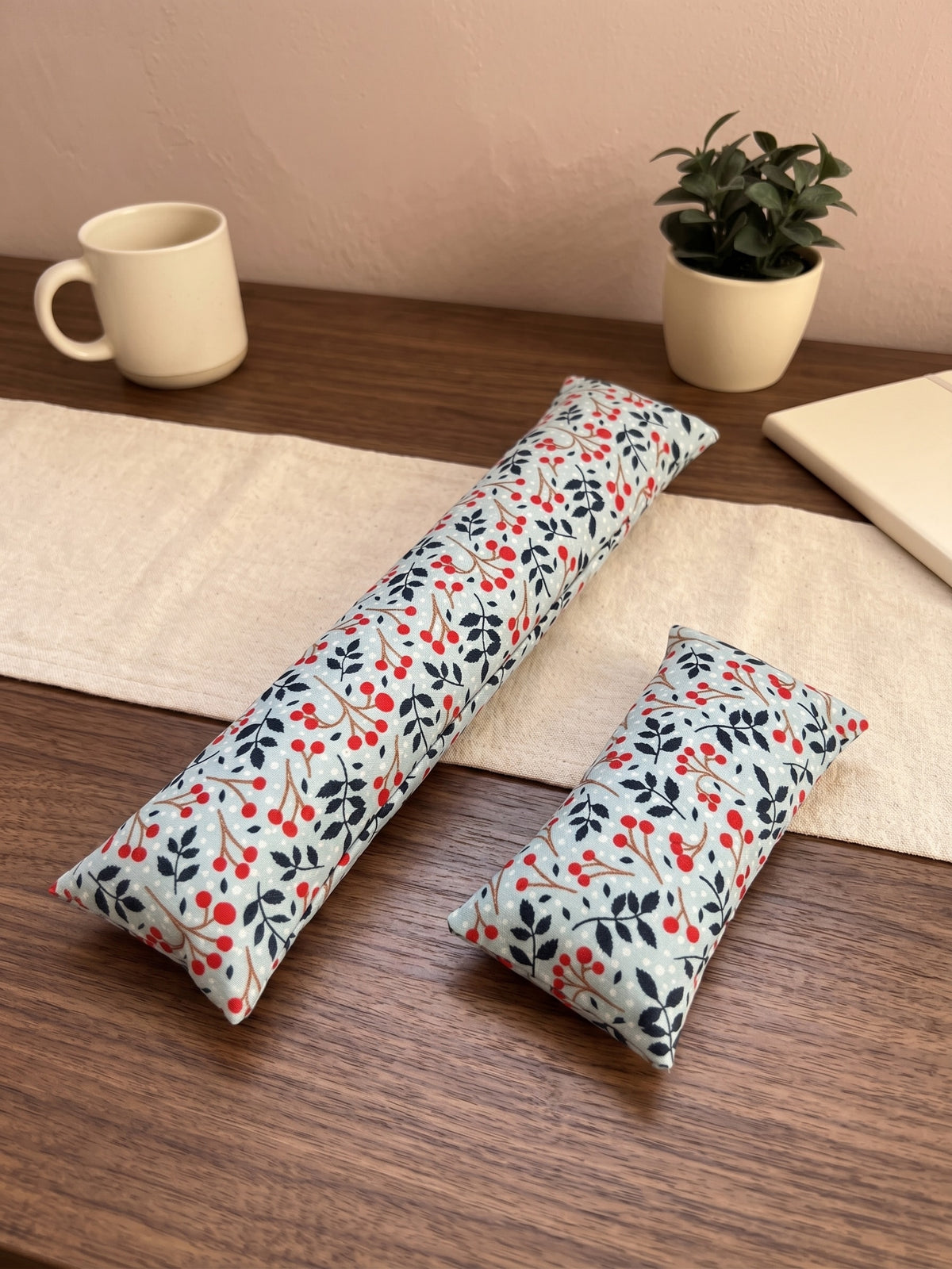 The two pieces of the winterberry set, a keyboard wrist rest and a mouse wrist rest